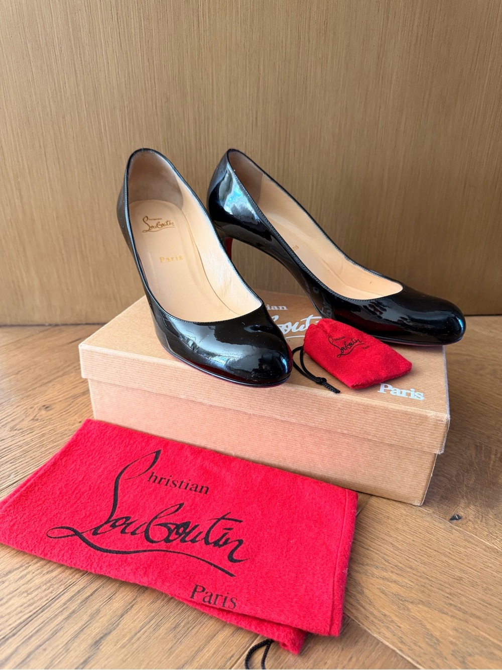Christian Louboutin Black Patent Round-Toe Pumps with Red Sole